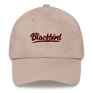 Beige dad hat with the word "blackbird" embroidered in cursive font on the front.