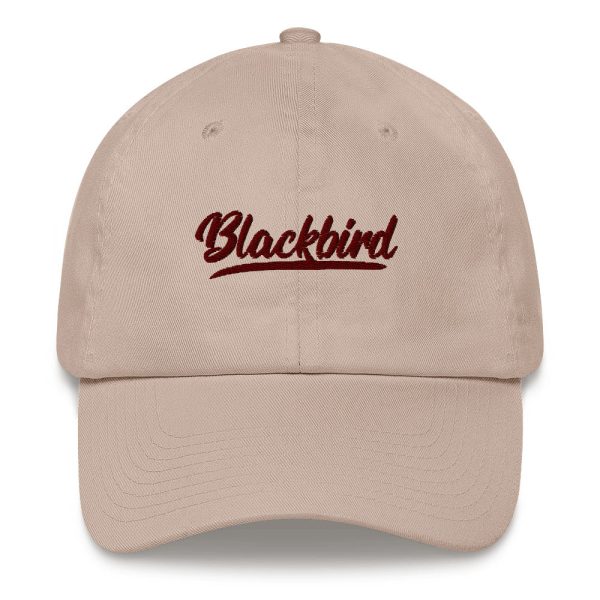 Beige dad hat with the word "blackbird" embroidered in cursive font on the front.