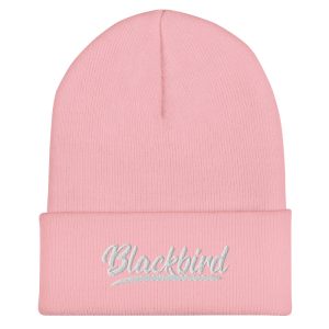 Pink cuffed beanie hat with the word "blackbird" embroidered on the front cuff in cursive script.