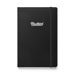 A black Hardcover JournalBook® with the word "blackbird" written in script font at the center of the cover, featuring an elastic band closure.