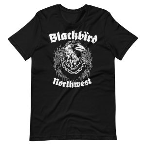 Motörhead Tee: Black t-shirt showcasing a white graphic design of a blackbird adorned with chains around its neck. "Blackbird" is prominently displayed above the bird, while "Northwest" appears below it in a bold, gothic font.