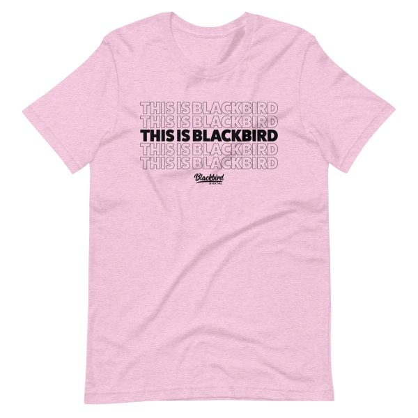 A pink This Is Blackbird Tee with the phrase "this is blackbird" repeated four times.